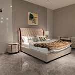 Round Cream Tufted Leather Nightstand with White Marble Top and Dark Glossy Frame
